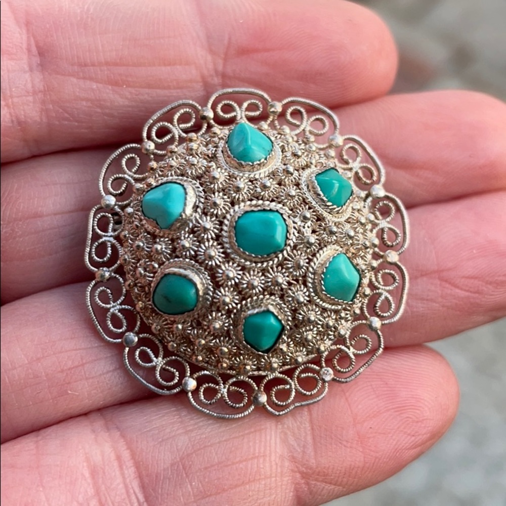Antique sterling silver brooch with turquoise